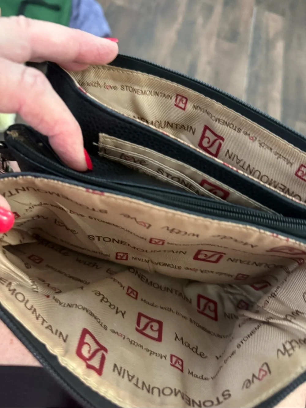 Black Pebbled Leather Wristlet Clutch with Logo Accent